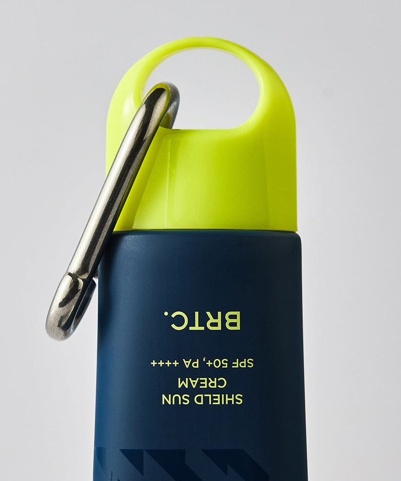 BRTC Homme Active Max Sheild Sunscreen 50ml bottle with carabiner cap for men by Gentleman Korea, navy and lime travel sunscreen for gentlemen