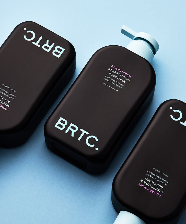 BRTC Power Homme Acne Solution Body Wash 500ml - Gentleman Korea: Black pump bottles arranged on blue background