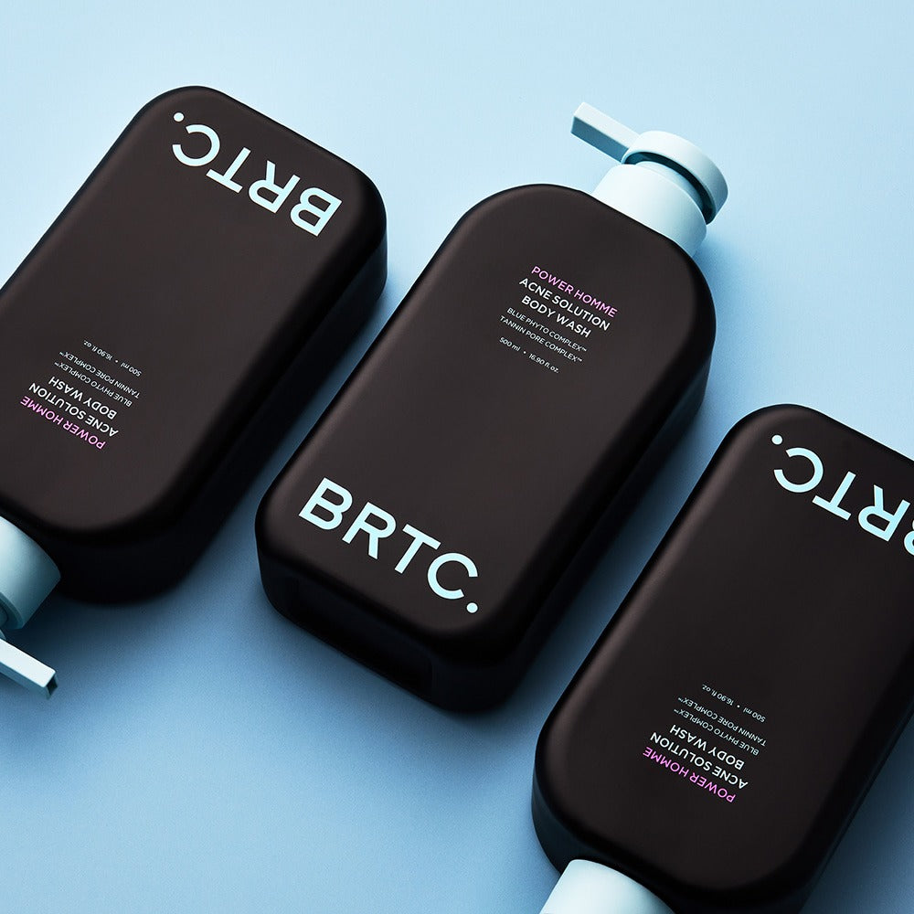 BRTC Power Homme Acne Solution Body Wash 500ml - Gentleman Korea: Black pump bottles arranged on blue background