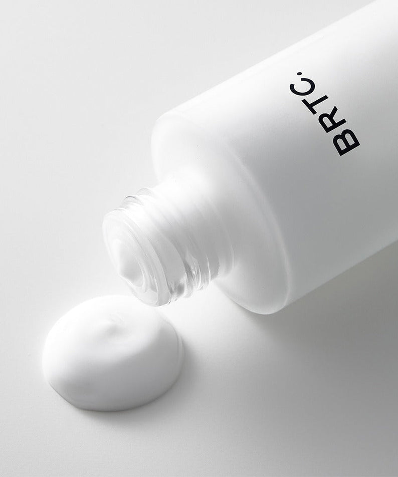 BRTC The First Emulsion 120ml bottle with cream texture on white background