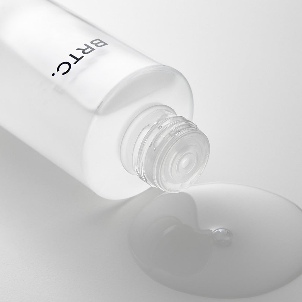 BRTC The First Essence 120ml bottle with clear liquid pouring out
