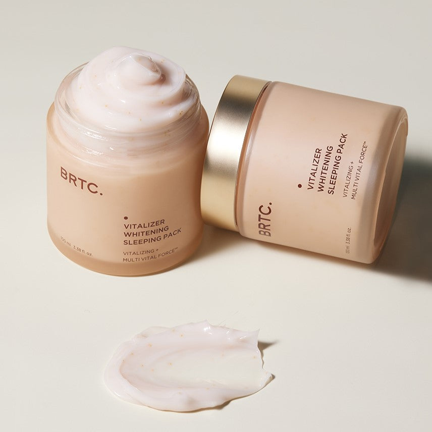 BRTC Vitalizer Whitening Sleeping Pack 100ml open jar with textured cream and lid beside, demonstrating skincare product texture.