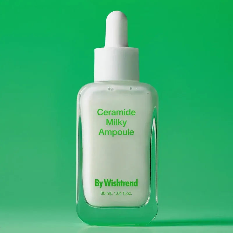 BY WISHTREND Ceramide Milky Ampoule 30ml skincare product bottle on green background