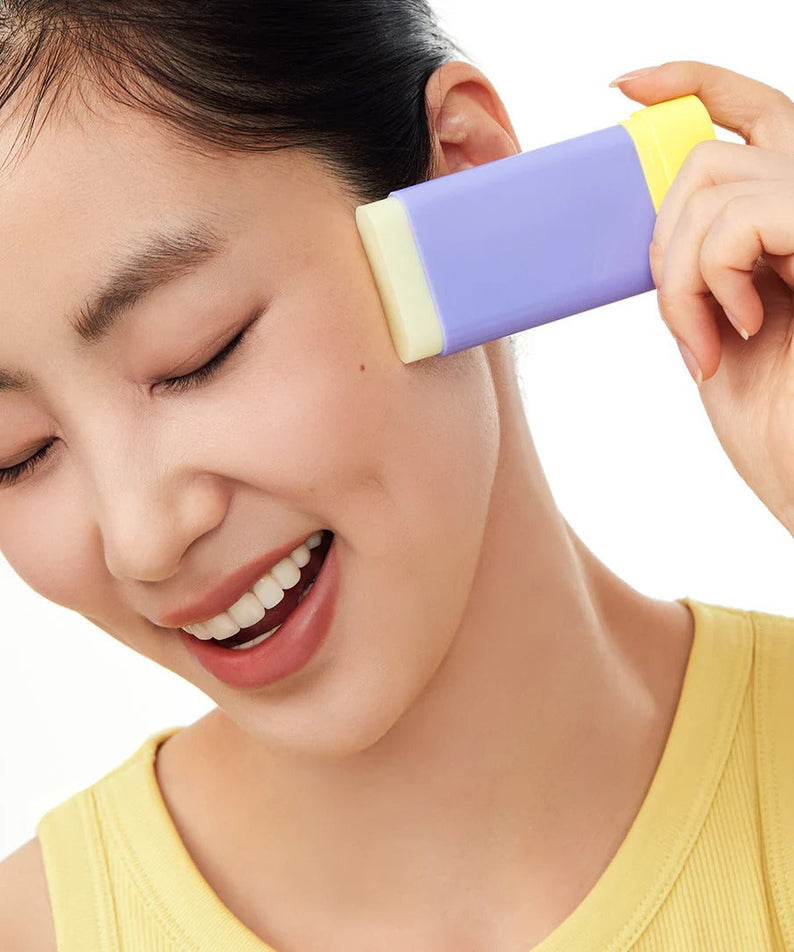 Woman using BY WISHTREND Pore Smoothing Bakuchoil Sun Stick 18g on face