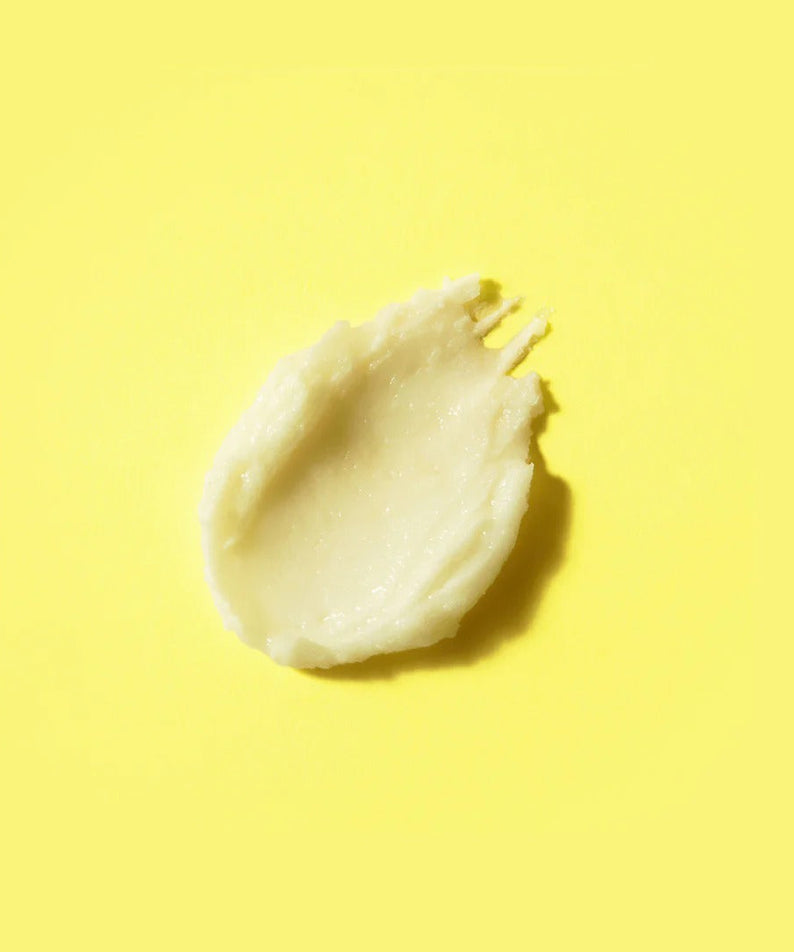 Texture of BY WISHTREND Pore Smoothing Bakuchoil Sun Stick 18g on yellow background