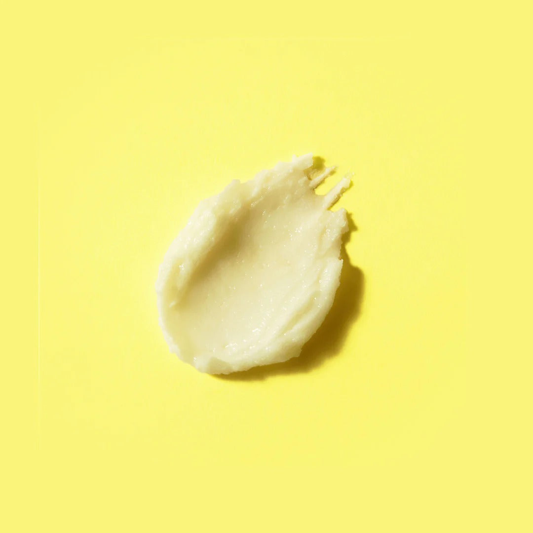 Texture of BY WISHTREND Pore Smoothing Bakuchoil Sun Stick 18g on yellow background