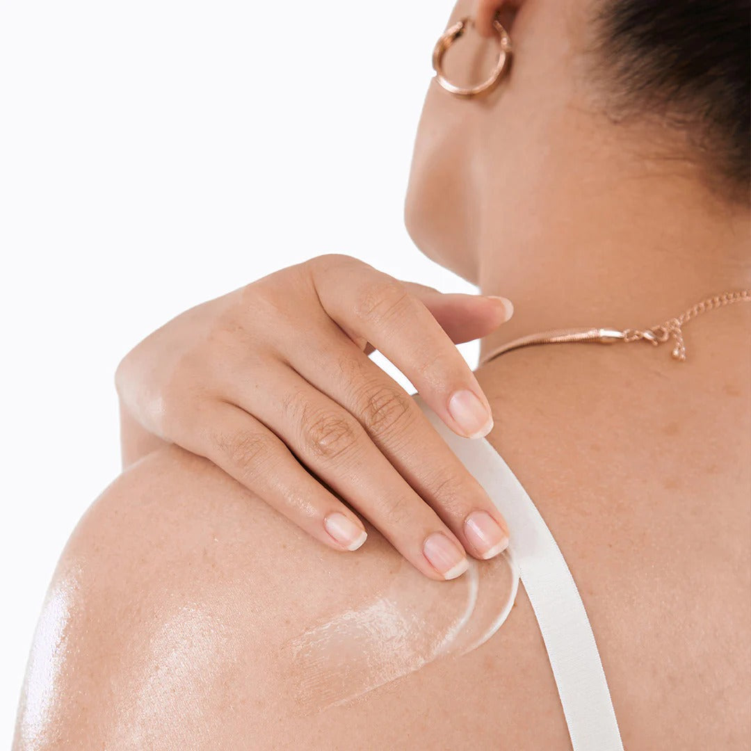 Applying BY WISHTREND Vitamin A-mazing Bakuchiol Body Lotion 150g on shoulder for smooth skin