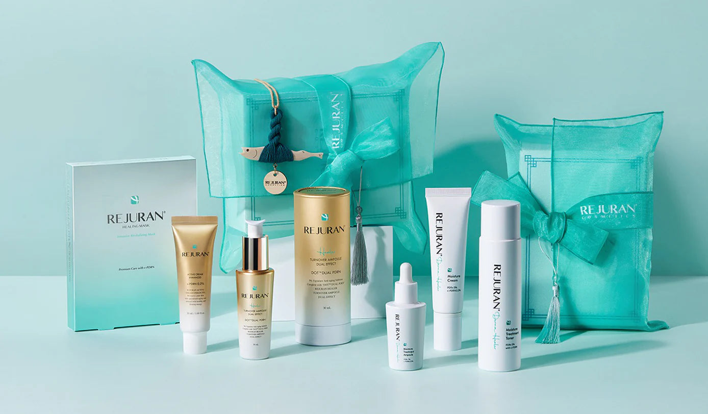 Collection of Rejuran skincare products with packaging on a light blue background.