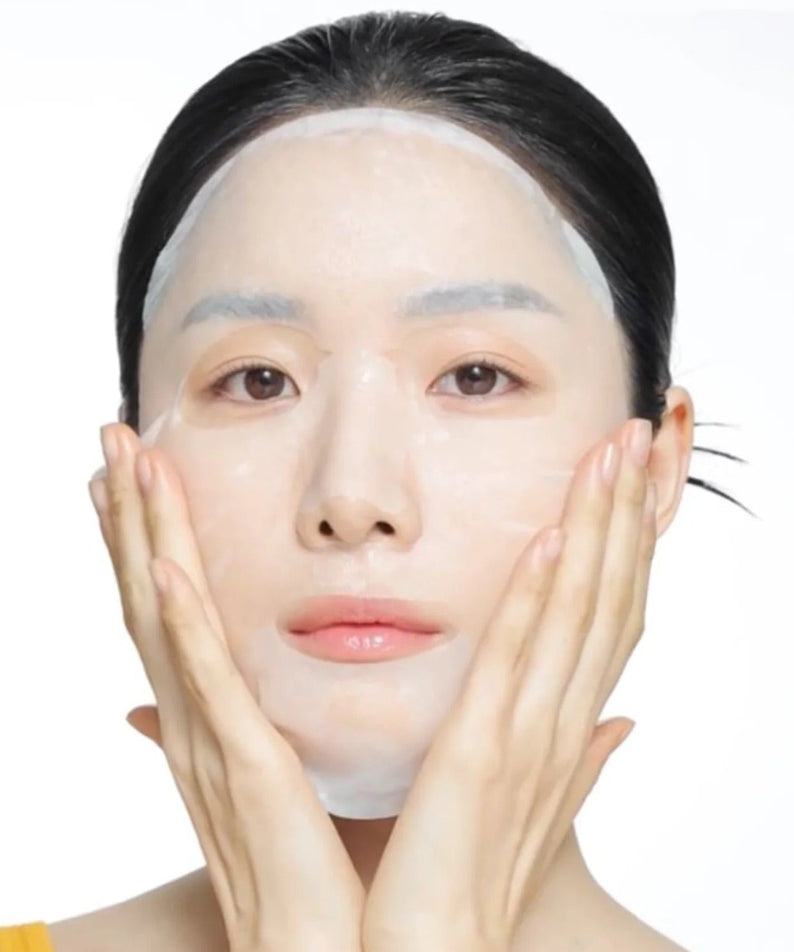 Person using CELIMAX Brightening Pore Blemish Serum Mask 10 sheets