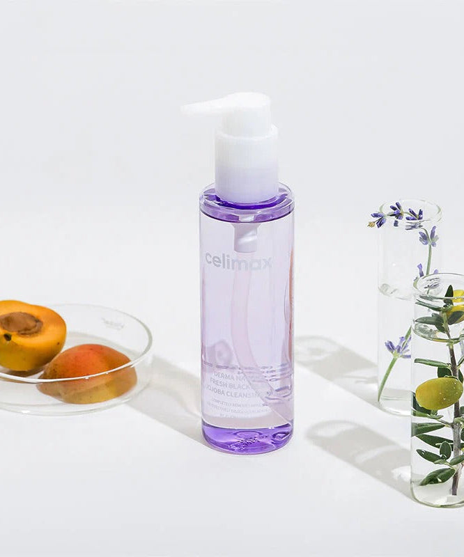 CELIMAX Derma Nature Fresh Blackhead Jojoba Cleansing Oil 150ml bottle with natural ingredients displayed around.