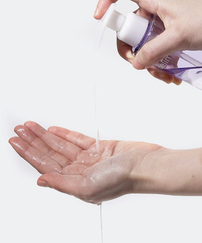 Person using CELIMAX Derma Nature Fresh Blackhead Jojoba Cleansing Oil 150ml on hands