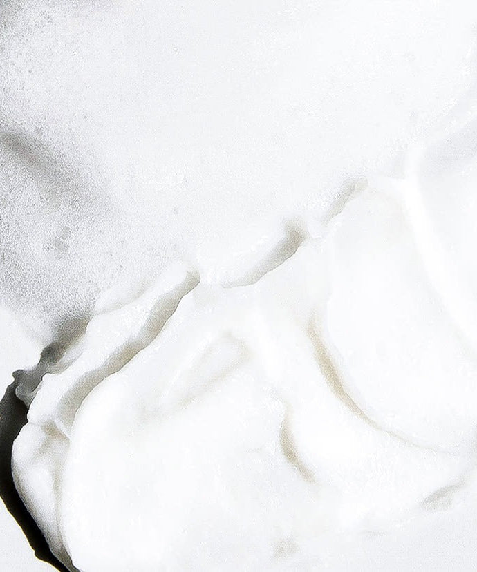 Foam texture of CELIMAX Derma Nature Relief Madecica pH Balancing Foam Cleansing 150ml on a surface