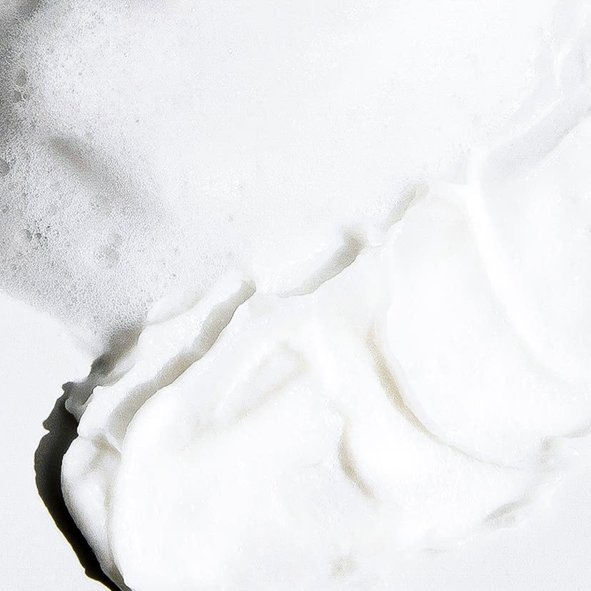 Foam texture of CELIMAX Derma Nature Relief Madecica pH Balancing Foam Cleansing 150ml on a surface