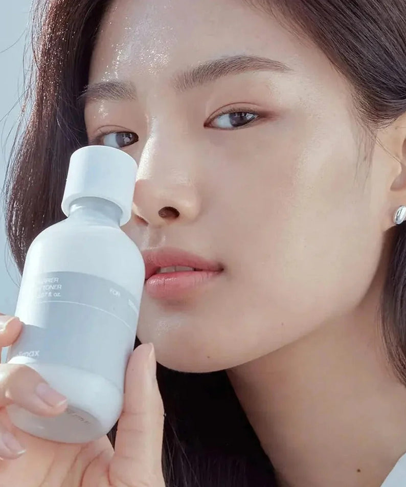 Woman holding CELIMAX Dual Barrier Creamy Toner 150ml