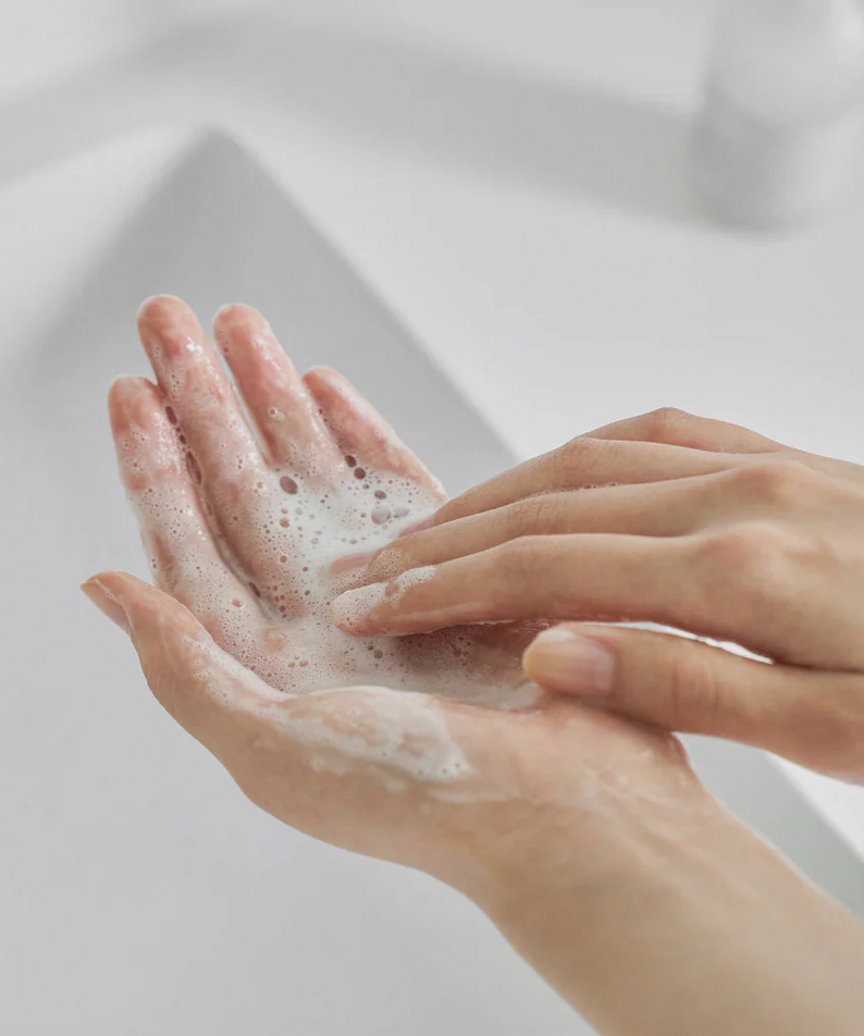 Hands lathering with CELIMAX Dual Barrier Mild Gel Cleanser 200ml for gentle cleansing.