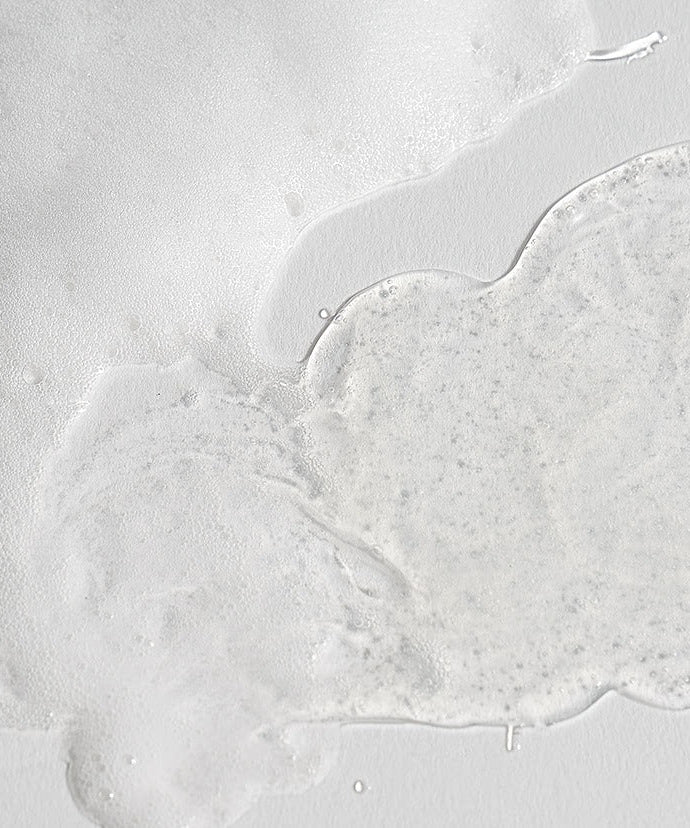 Texture of CELIMAX Dual Barrier Mild Gel Cleanser 200ml on a white surface, showcasing its smooth and gentle formula for skincare.
