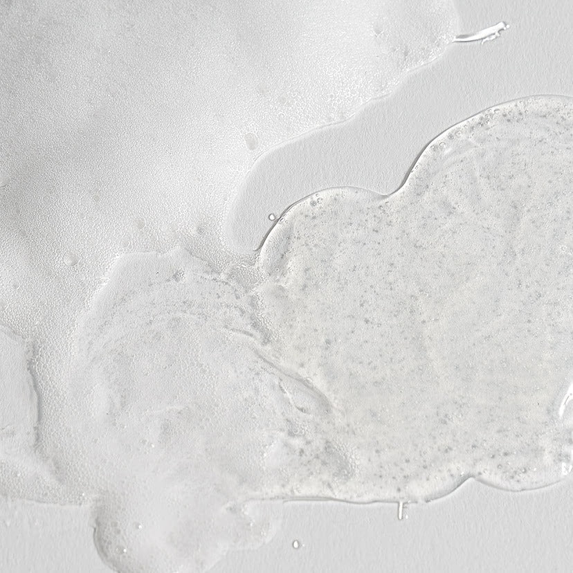 Texture of CELIMAX Dual Barrier Mild Gel Cleanser 200ml on a white surface, showcasing its smooth and gentle formula for skincare.
