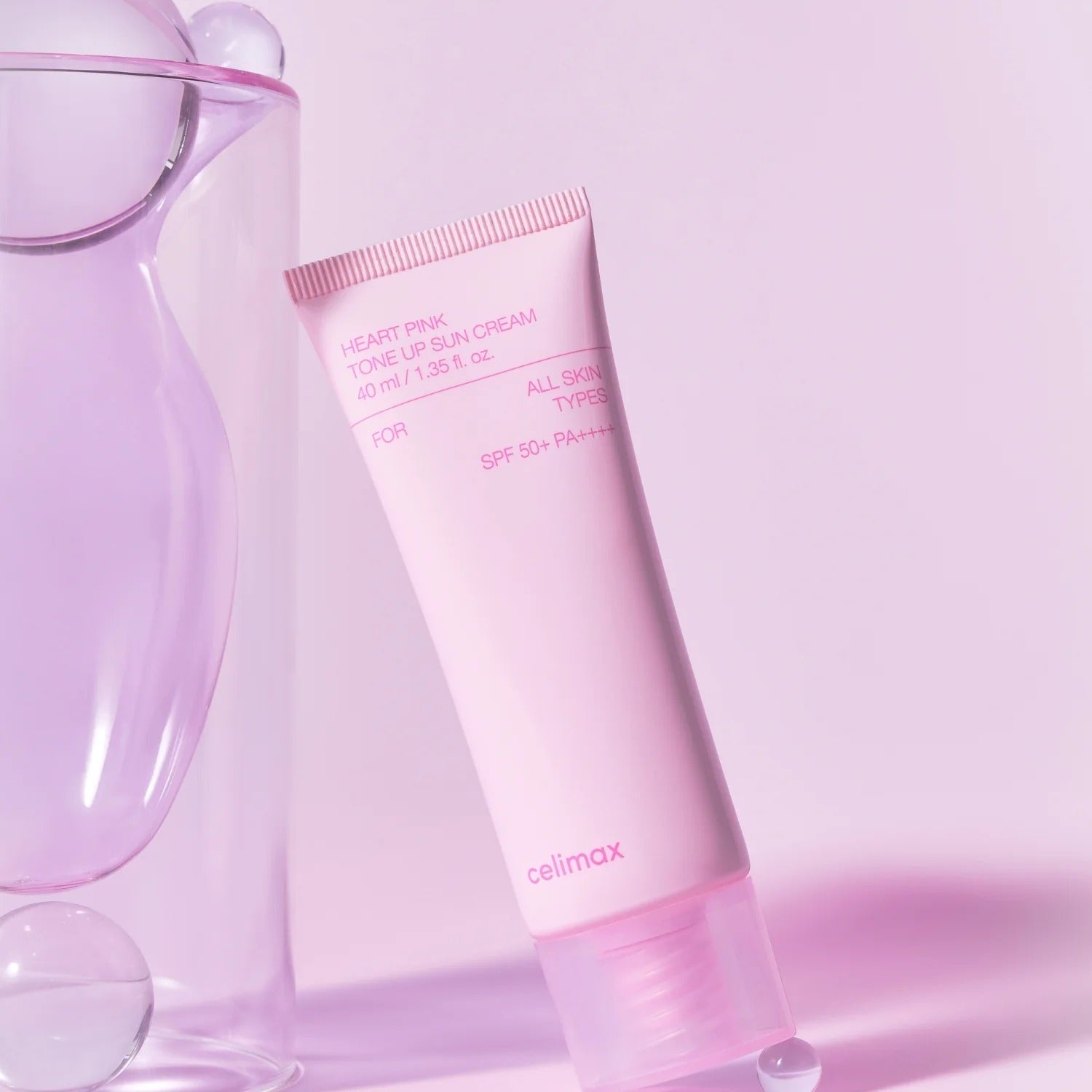 CELIMAX Heart Pink Tone-up Sun Cream 40ml in sleek pink packaging, suitable for all skin types with SPF 50+ protection.