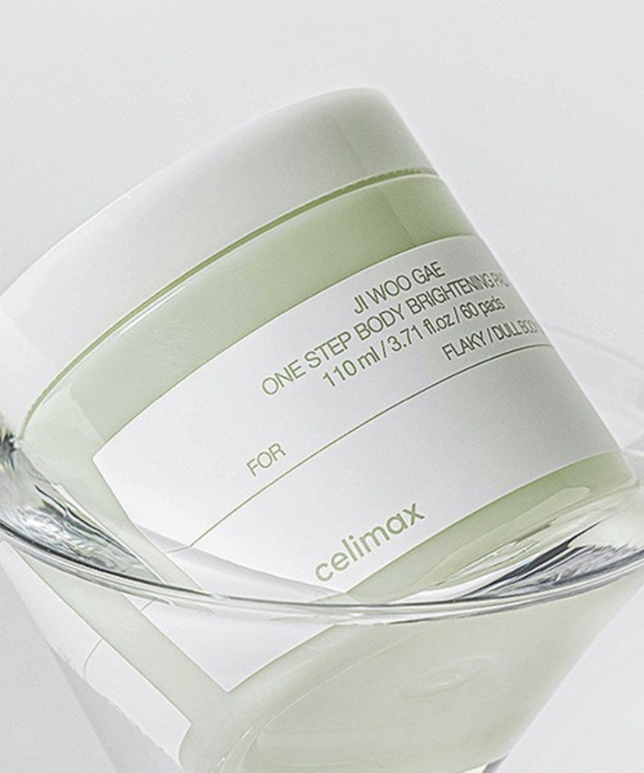CELIMAX Ji Woo Gae One Step Body Brightening Pad 60 Pads packaging on clear surface