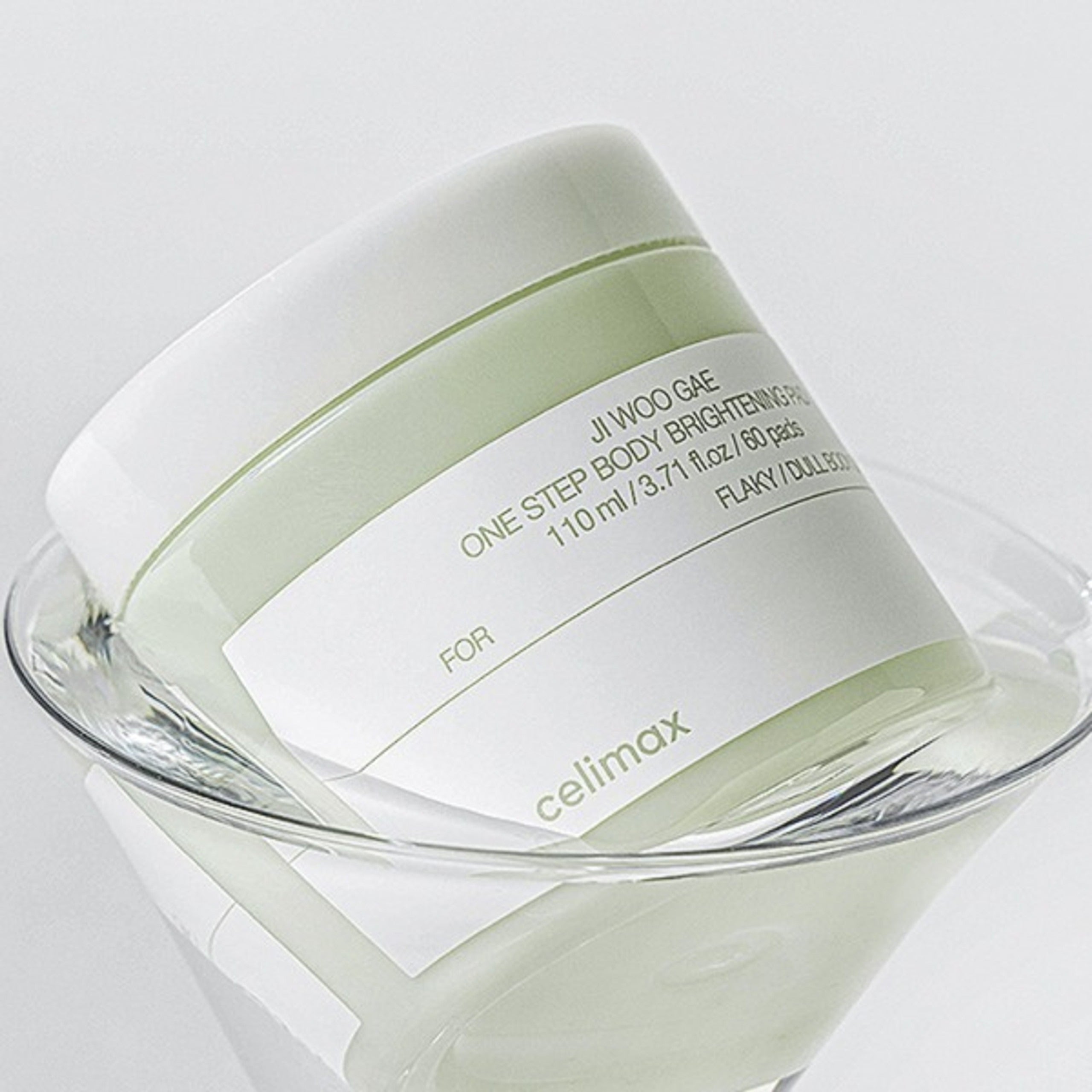 CELIMAX Ji Woo Gae One Step Body Brightening Pad 60 Pads packaging on clear surface
