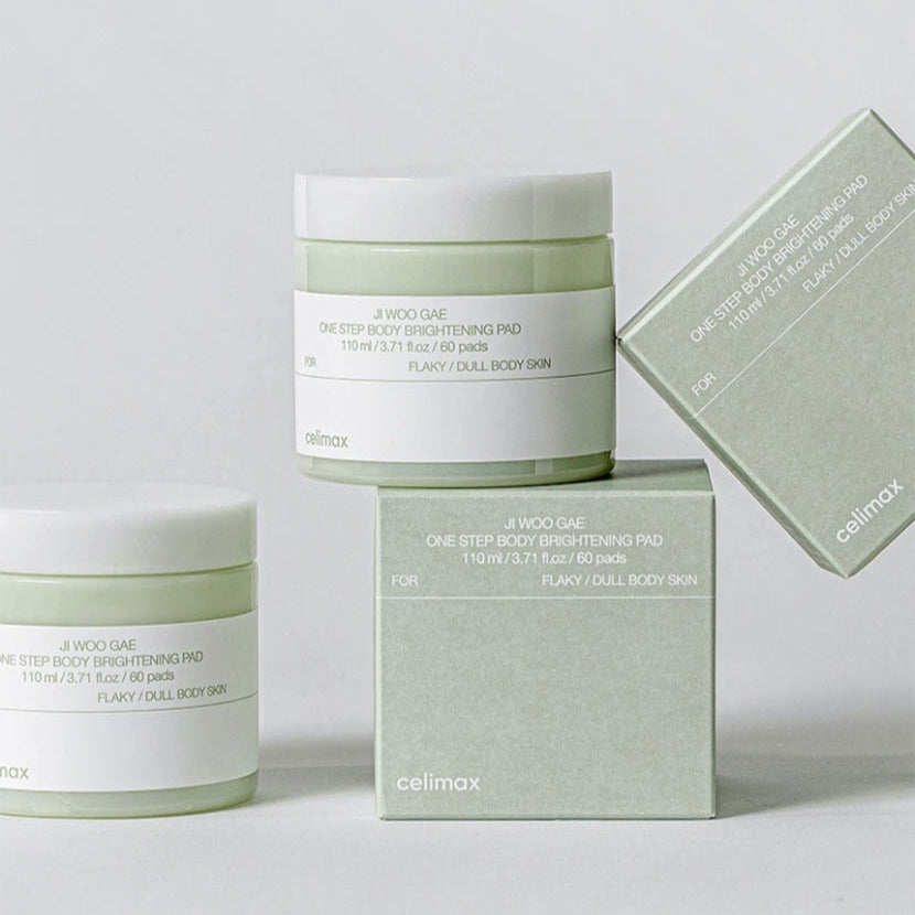 CELIMAX Ji Woo Gae One Step Body Brightening Pad 60 Pads displayed in jars and box packaging on a light background.
