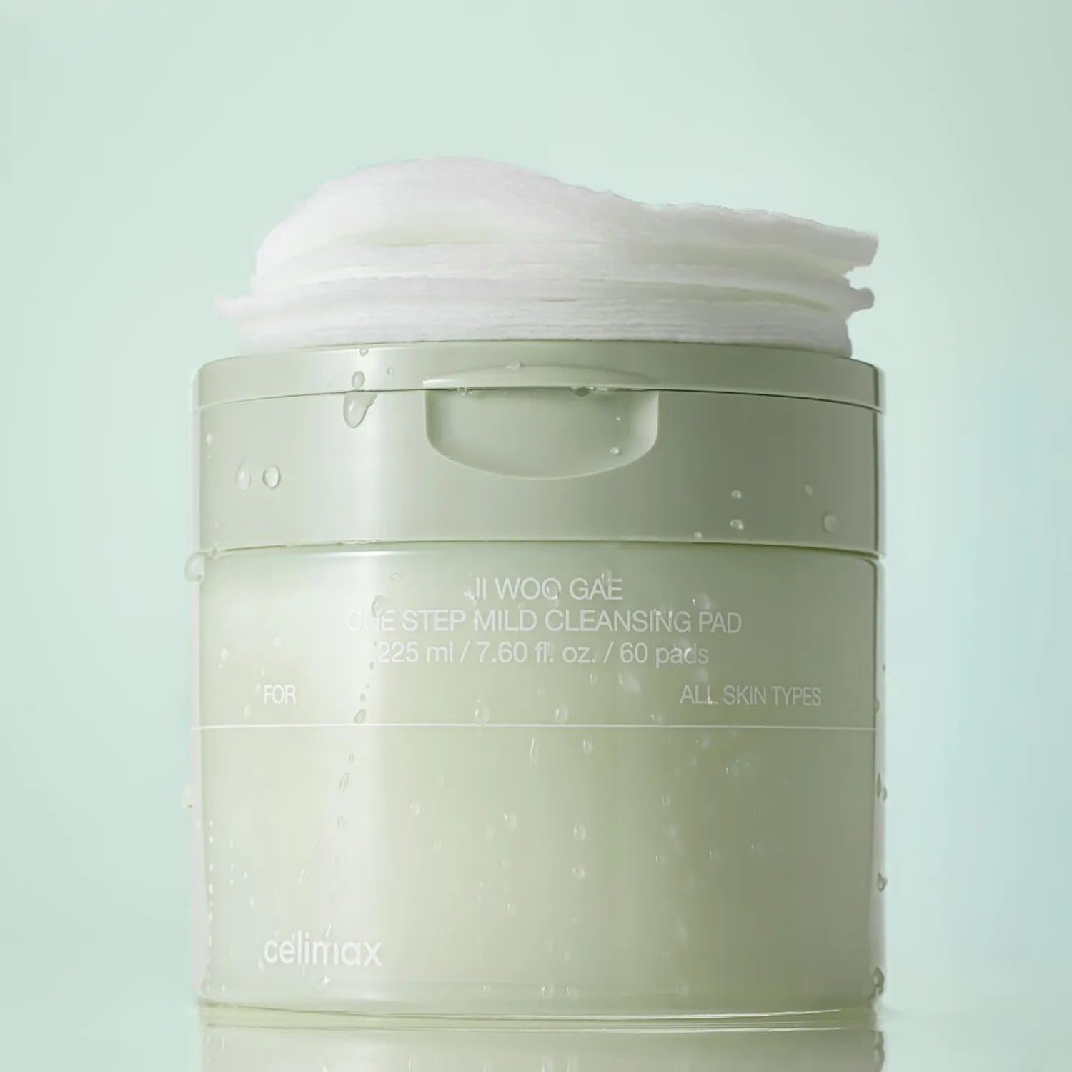 CELIMAX Ji Woo Gae One Step Mild Cleansing Pad 60 pads packaging in a light green container with visible cleansing pads.