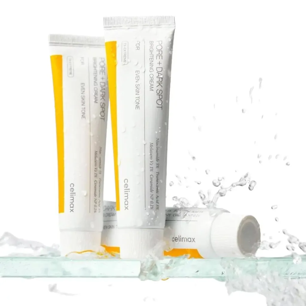 CELIMAX Pore Dark Spot Brightening Cream 35ml tubes with water splash enhancing the skincare product's features.