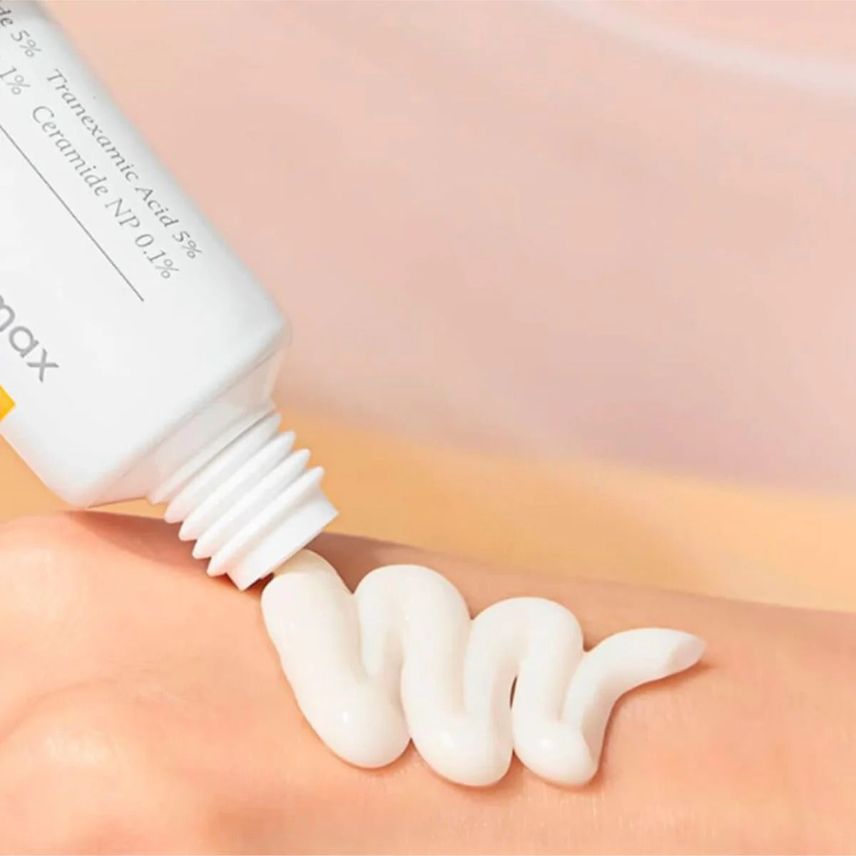 Application of CELIMAX Pore Dark Spot Brightening Cream 35ml on skin, showing cream texture