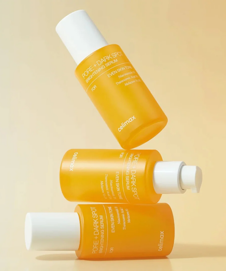 CELIMAX Pore Dark Spot brightening Serum 30ml bottles stacked elegantly on a beige background.