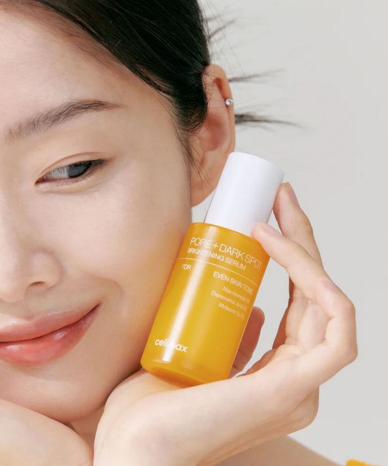 Woman holding CELIMAX Pore Dark Spot brightening Serum 30ml, showcasing skincare benefits.