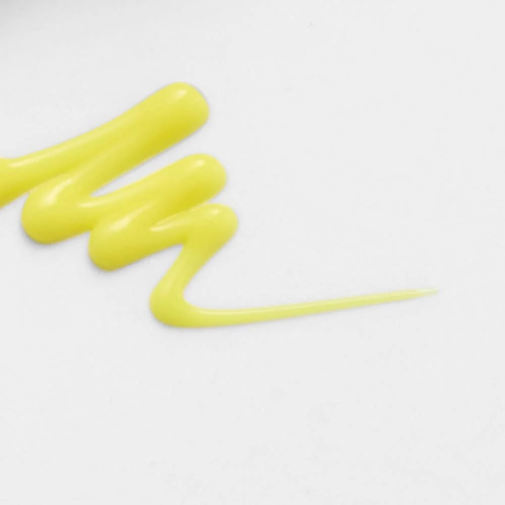 Texture of CELIMAX Retinol Shot Tightening Booster 15ml against white background.