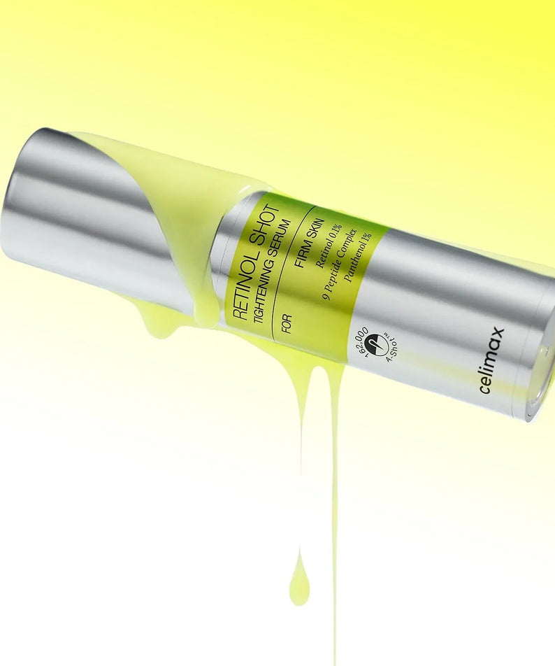 Image of CELIMAX Retinol Shot Tightening Serum 30ml bottle with yellow serum dripping on a yellow background.