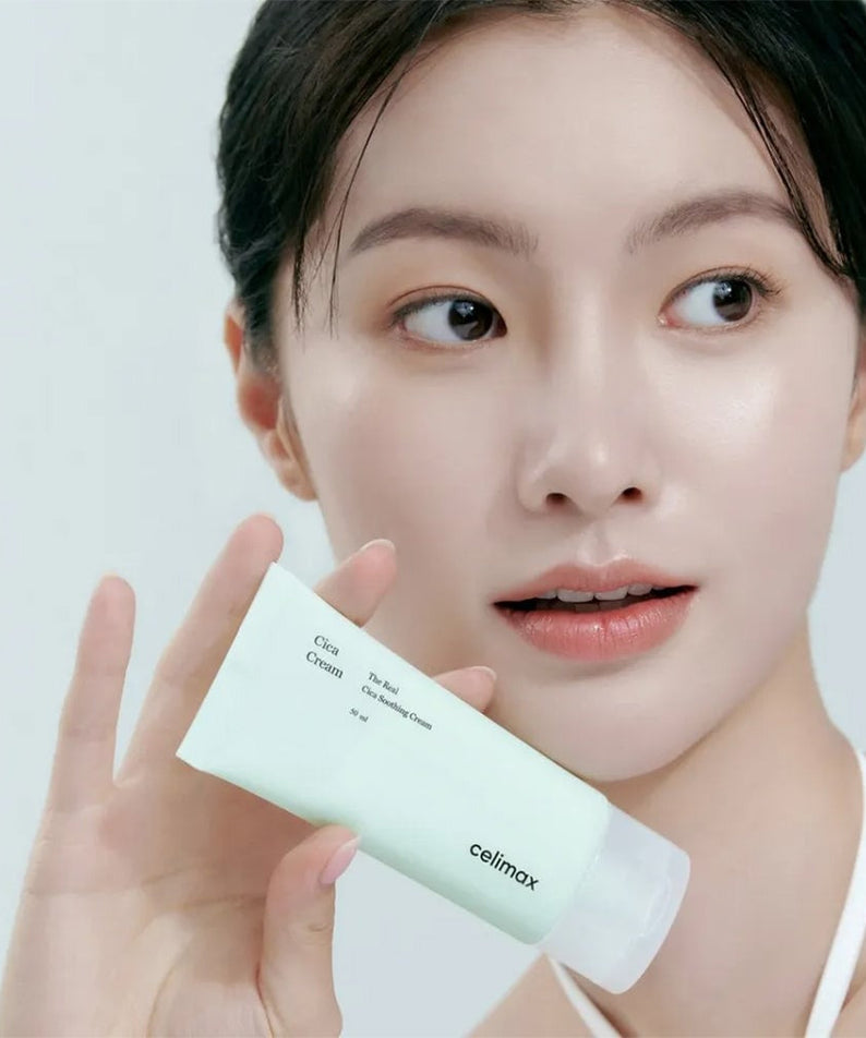 Woman holding CELIMAX The Real Cica Soothing Cream 50ml