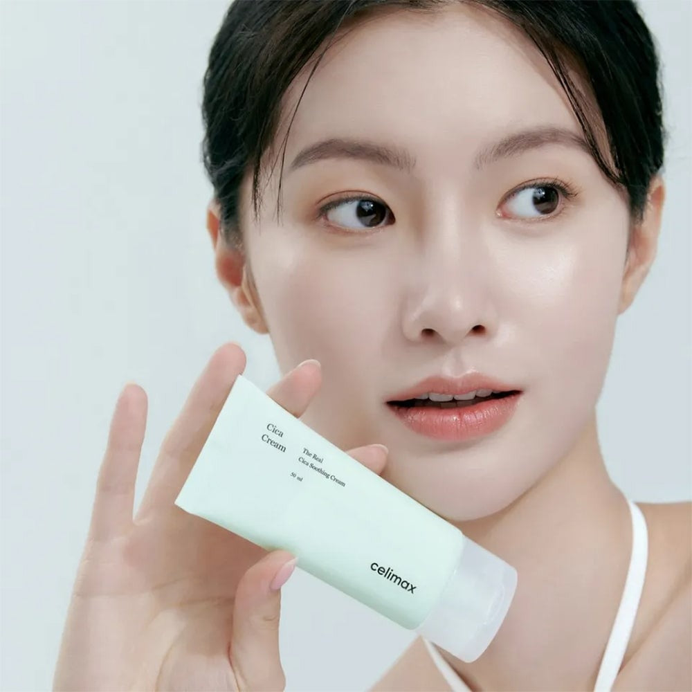Woman holding CELIMAX The Real Cica Soothing Cream 50ml