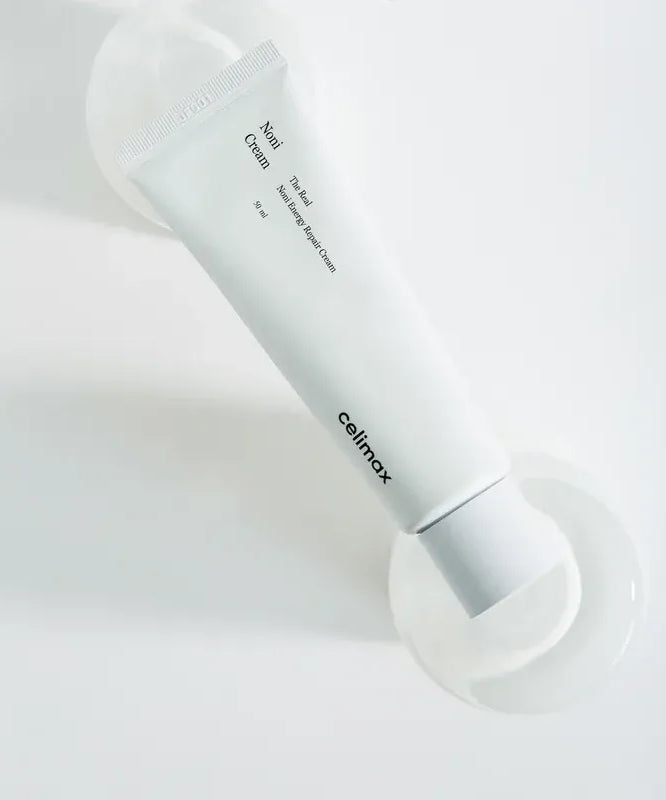 CELIMAX The Real Noni Energy Repair Cream 50ml in sleek white tube on neutral background