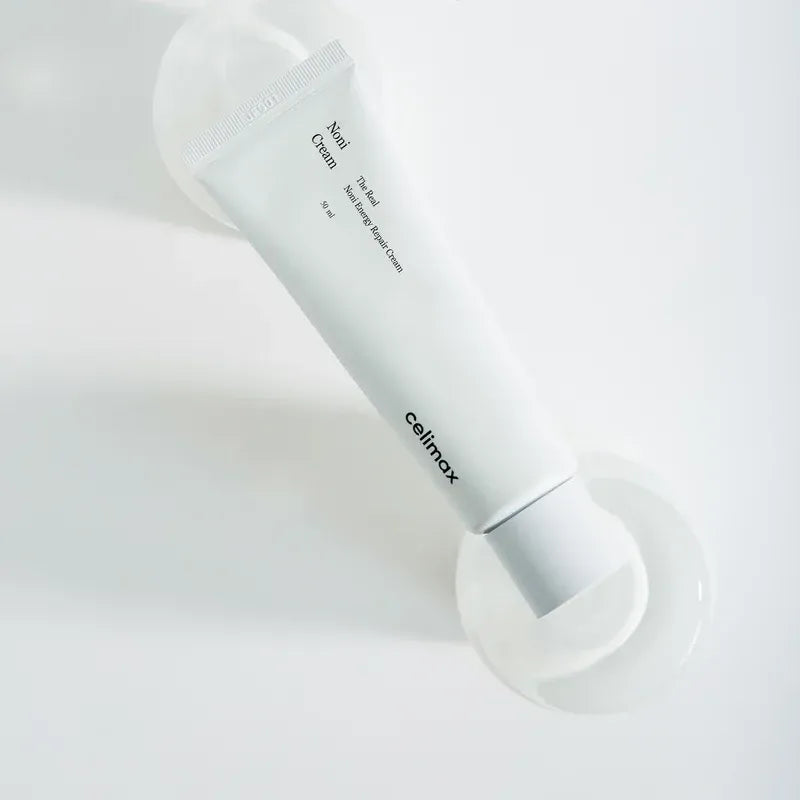 CELIMAX The Real Noni Energy Repair Cream 50ml in sleek white tube on neutral background