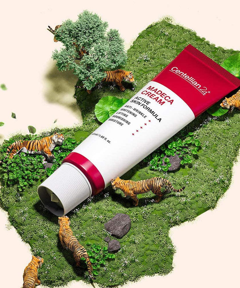 CENTELLIAN 24 Madeca Cream Active Skin Formula 50ml tube on decorative display with tigers and greenery