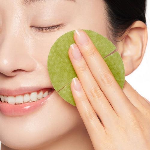 Woman using CENTELLIAN 24 Madeca Real Green Pore Pad 170g (60 sheets) on face for skincare routine