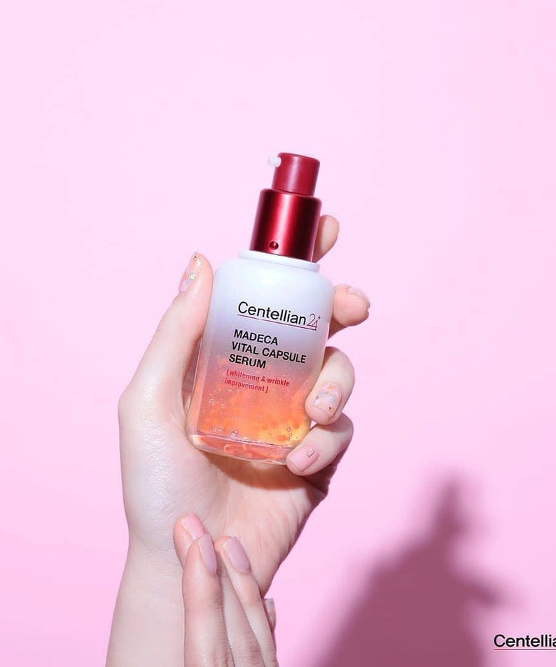 CENTELLIAN 24 Madeca Vital Capsule Serum 50ml held in hand against pink background
