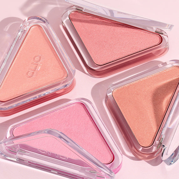 CLIO Essential Blush Tab in various shades, highlighting the unique triangle compact design. Perfect for a natural, radiant glow.