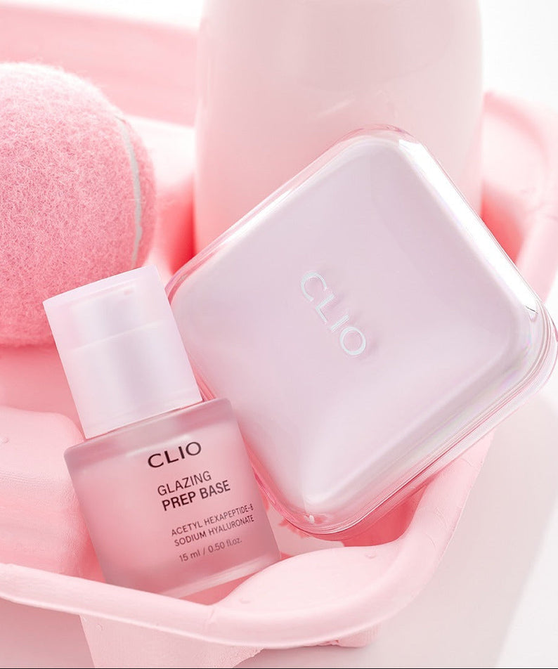 CLIO Glazing Prep Base 40ml cosmetic bottle and pink packaging in a stylish setting.