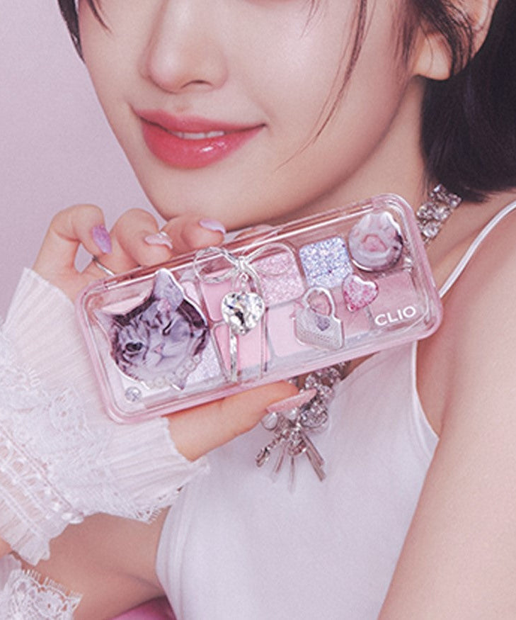 CLIO Pro Eye Palette Air (#01 to #15) featuring assorted shades in a decorative case held by a person with pink nails and stylish outfit.