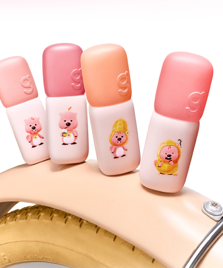 COLORGRAM Colorgram Nude Blur Tint AD 5g in various shades displayed on a bicycle wheel, perfect for natural makeup looks.