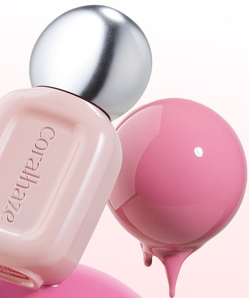 CORALHAZE Dew Drop Tint 4.5g bottle with pink tint droplet on a reflective surface.
