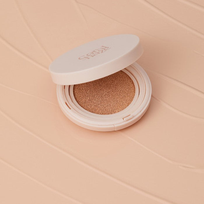 CORALHAZE Fixing Blur Cushion SPF50 PA++++ 13g on a textured background