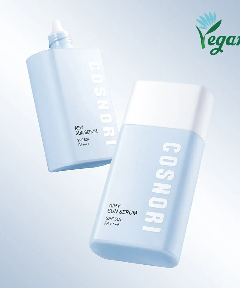 COSNORI Airy Tone Up Sun Serum bottles with vegan logo, SPF 50+ protection for brightening and sun care, displayed on a blue background.