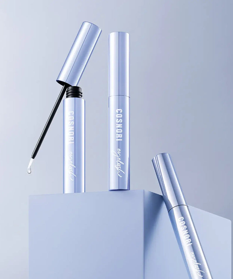 COSNORI Intensive Eyelash Serum tubes displayed on a minimalist blue background