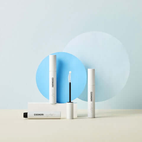 COSNORI Long Active Eyelash Serum product display against a blue and cream background.
