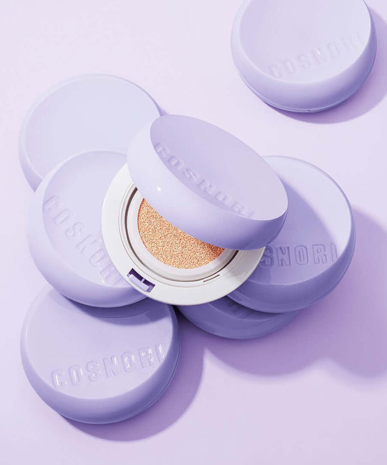 COSNORI Panthenol Barrier Cushion SPF50+PA++++ compact on purple background