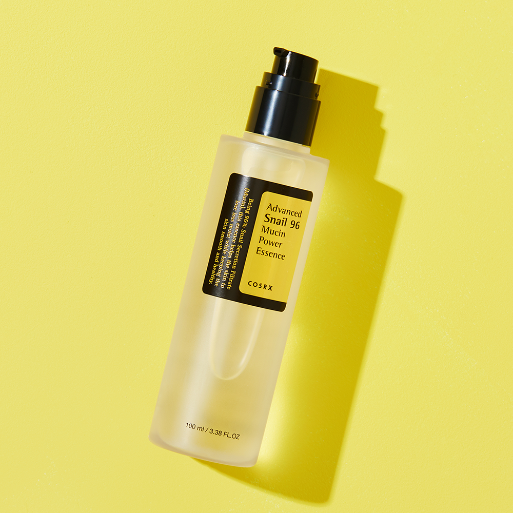 COSRX Advanced Snail 96 Mucin Power Essence 100ml bottle on yellow background